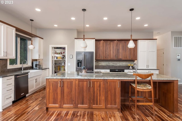 46769 Goodpasture Rd, Vida, OR 97488 - kitchen featuring dark wood-style flooring, decorative backsplash, dishwasher, a sink, and high quality fridge