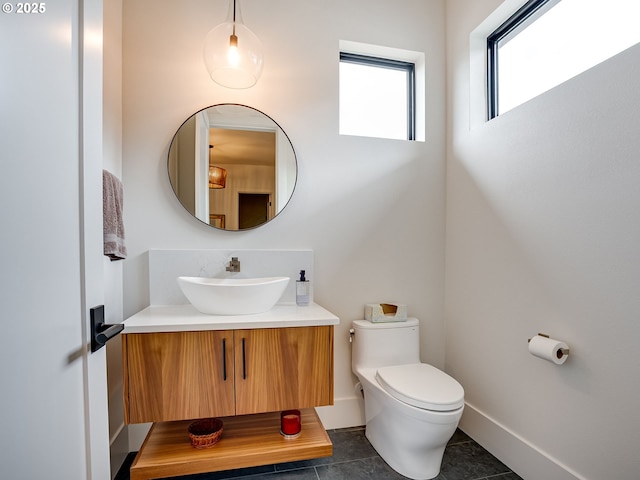 522 NE Province Dr, Camas, WA 98607 - half bathroom featuring vanity, tile patterned flooring, toilet, and baseboards