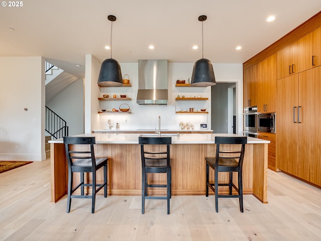 522 NE Province Dr, Camas, WA 98607 - kitchen featuring open shelves, wall chimney range hood, modern cabinets, light countertops, and recessed lighting