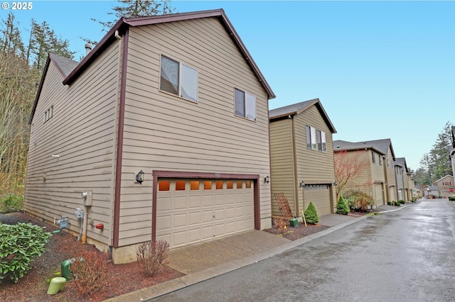 view of side of property with a garage