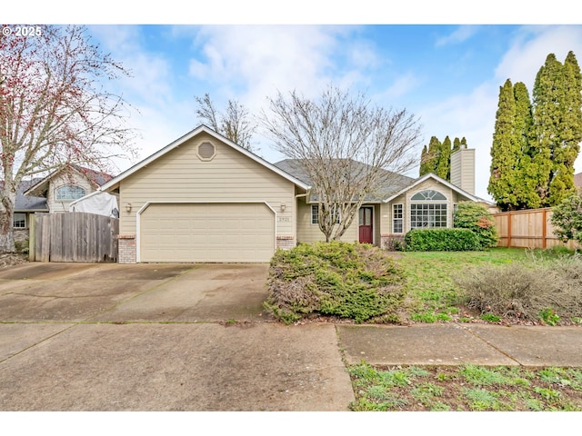 single story home with concrete driveway, brick siding, fence, and a garage