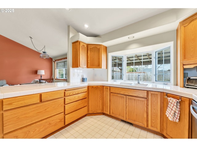 kitchen with light tile patterned flooring, a sink, recessed lighting, a toaster, and visible vents