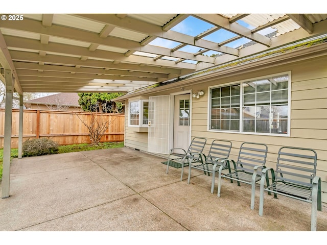 view of patio with fence and a pergola