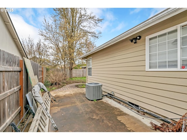 view of patio featuring a fenced backyard and central air condition unit