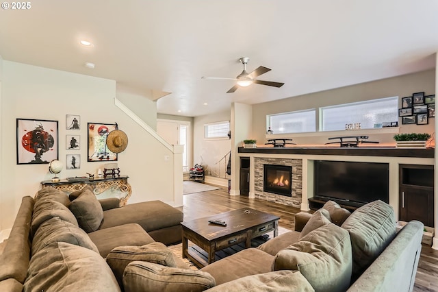 living room featuring baseboards, wood finished floors, recessed lighting, and ceiling fan
