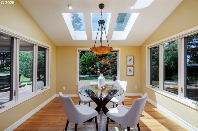 2350 SW Gregory Dr, West Linn, OR 97068 - dining area with lofted ceiling, a skylight, light wood-style floors, and plenty of natural light
