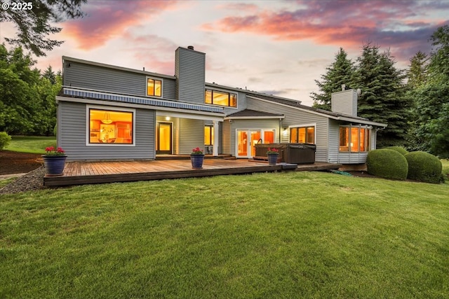 2350 SW Gregory Dr, West Linn, OR 97068 - back of house at dusk featuring a chimney, a deck, and a lawn