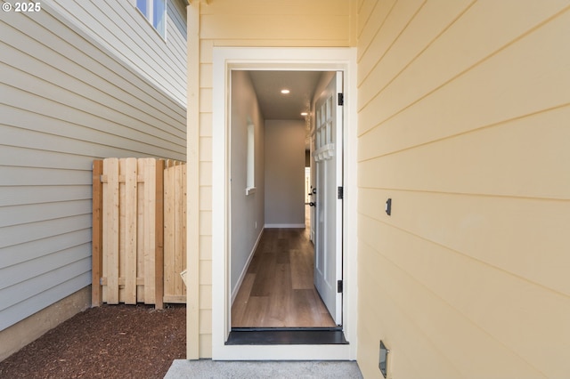 entrance to property featuring fence