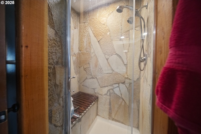 full bath with a shower stall
