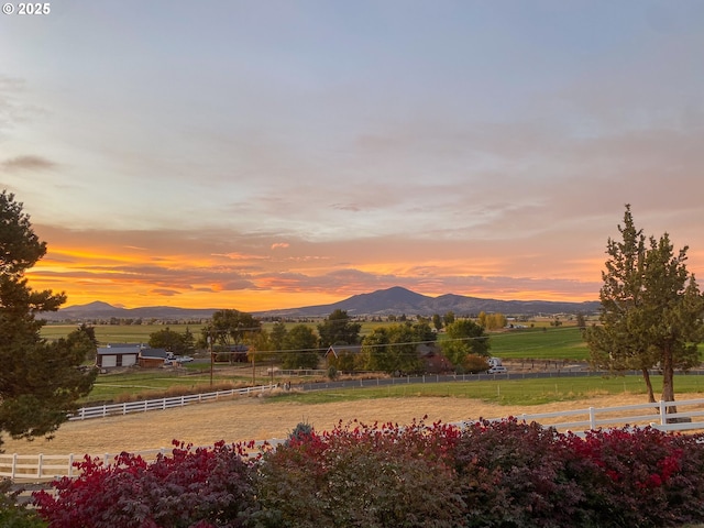 mountain view featuring a rural view