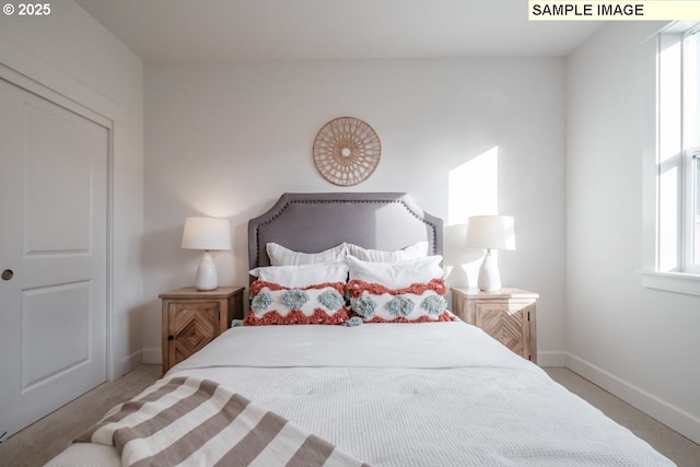 carpeted bedroom featuring multiple windows