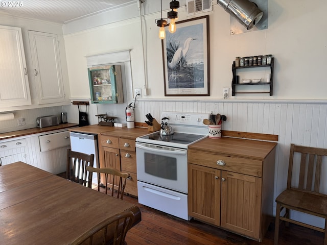 kitchen with white appliances, visible vents, wainscoting, dark wood-style floors, and butcher block counters