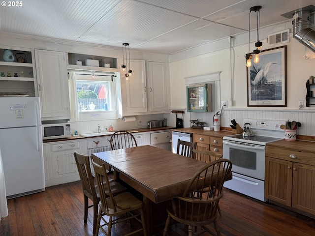 kitchen featuring white appliances, visible vents, open shelves, dark wood finished floors, and pendant lighting