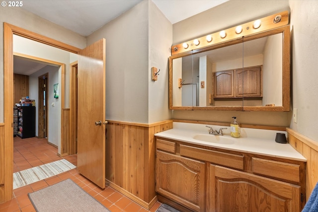 62436 Mink Ln, Summerville, OR 97876 - bathroom with wainscoting, vanity, wooden walls, and tile patterned floors