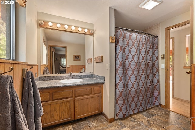 62436 Mink Ln, Summerville, OR 97876 - full bathroom featuring vanity, stone finish floors, and a shower with shower curtain