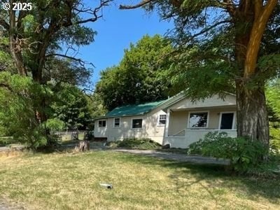 62436 Mink Ln, Summerville, OR 97876 - back of house with a lawn and stucco siding