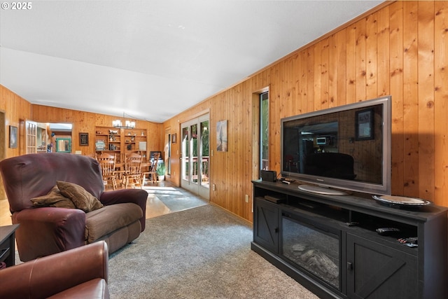 62436 Mink Ln, Summerville, OR 97876 - carpeted living room with wooden walls, a chandelier, and vaulted ceiling