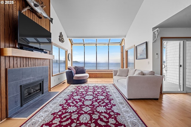 765 5th Ave Unit 5, Hammond, OR 97121 - living room featuring wood finished floors and a tile fireplace