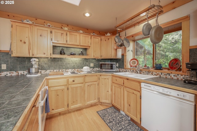 35919 NE 25th Cir, Washougal, WA 98671 - kitchen featuring white appliances, light brown cabinetry, tile countertops, a sink, and decorative backsplash