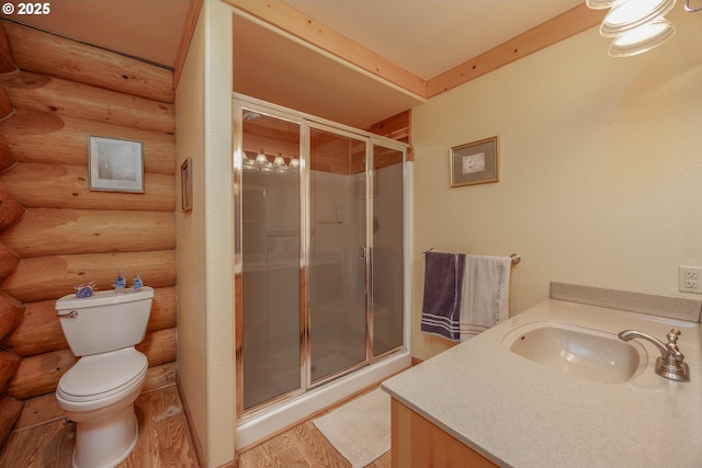 35919 NE 25th Cir, Washougal, WA 98671 - full bathroom with rustic walls, a shower stall, vanity, toilet, and wood finished floors