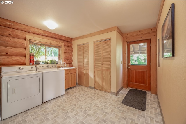 35919 NE 25th Cir, Washougal, WA 98671 - washroom featuring rustic walls, cabinet space, independent washer and dryer, and healthy amount of natural light