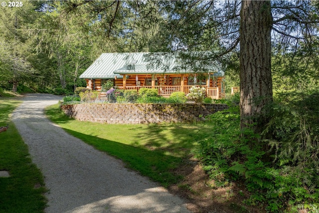35919 NE 25th Cir, Washougal, WA 98671 - log home with log exterior, a porch, a standing seam roof, driveway, and metal roof