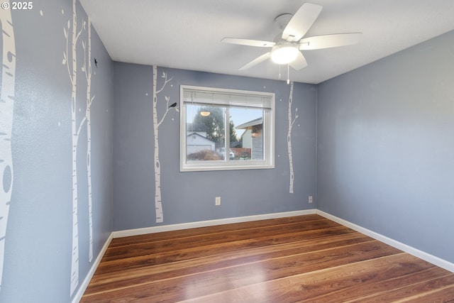 unfurnished room with hardwood / wood-style floors and ceiling fan