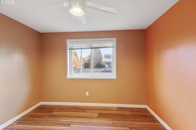 spare room featuring ceiling fan and light wood-type flooring