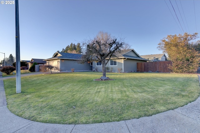 single story home with a front lawn