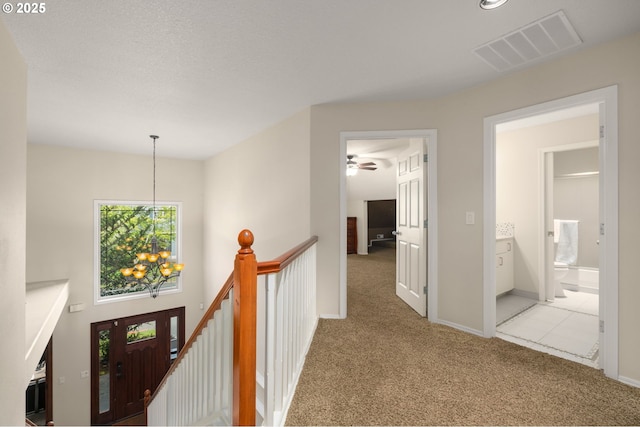 22767 SW Saunders Dr, Sherwood, OR 97140 - corridor featuring an upstairs landing, a chandelier, carpet flooring, and baseboards