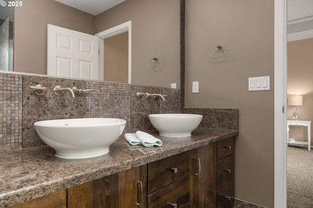 22767 SW Saunders Dr, Sherwood, OR 97140 - bathroom featuring double vanity, tile walls, and a wainscoted wall
