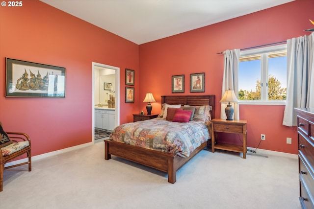 bedroom featuring baseboards, carpet flooring, and connected bathroom