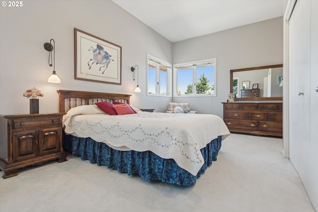 bedroom featuring light colored carpet
