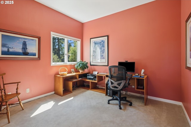 carpeted home office featuring baseboards