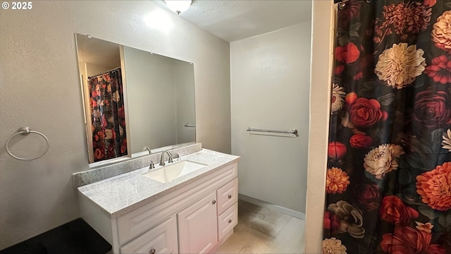 bathroom with curtained shower and vanity