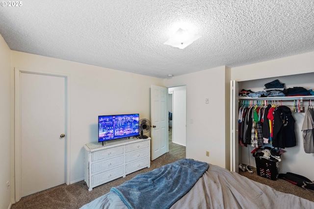 1030 Augustine Ave, Coos Bay, OR 97420 - bedroom featuring a textured ceiling, carpet flooring, and a closet