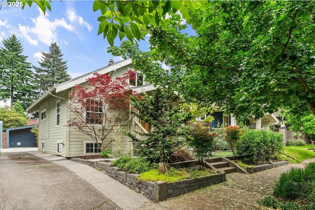 view of side of property with an outdoor structure