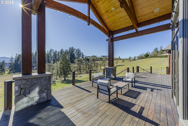 wooden deck with a lawn