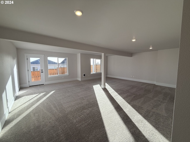 carpeted spare room featuring recessed lighting and baseboards