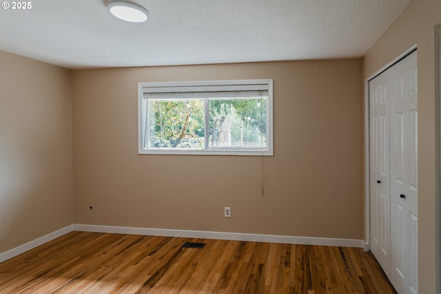 14424 SE Bevington Ct, Milwaukie, OR 97267 - unfurnished bedroom featuring a closet and wood finished floors