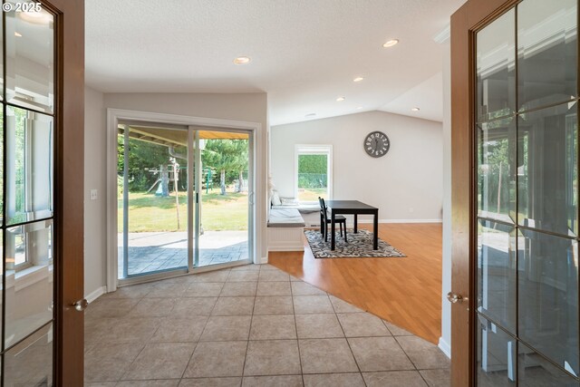 14424 SE Bevington Ct, Milwaukie, OR 97267 - doorway to outside with lofted ceiling, tile patterned floors, and recessed lighting