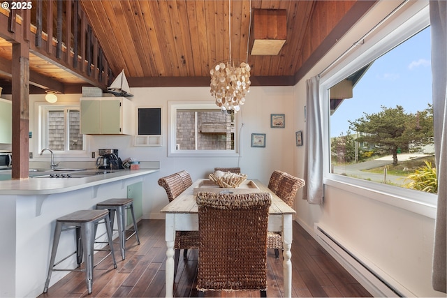 33565 Shore Dr, Pacific City, OR 97135 - dining room featuring wooden ceiling, a baseboard radiator, dark wood-style floors, vaulted ceiling, and a chandelier