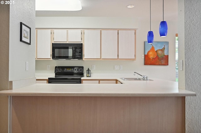 4701 NE 77th Ave, Vancouver, WA 98662 - kitchen featuring black appliances, a sink, a peninsula, a textured wall, and light countertops