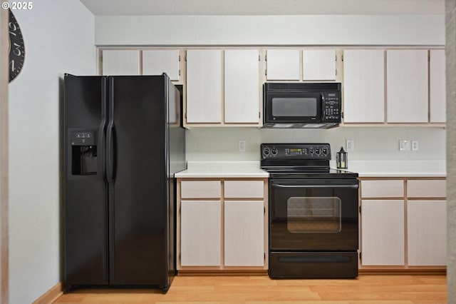 4701 NE 77th Ave, Vancouver, WA 98662 - kitchen with black appliances, light countertops, and light wood finished floors
