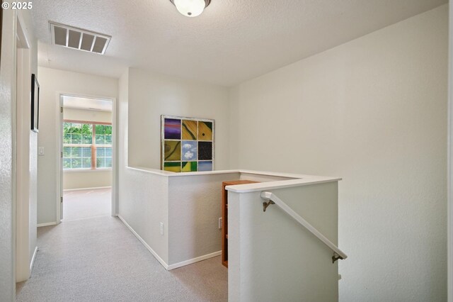 4701 NE 77th Ave, Vancouver, WA 98662 - corridor featuring an upstairs landing, carpet floors, baseboards, and a textured ceiling