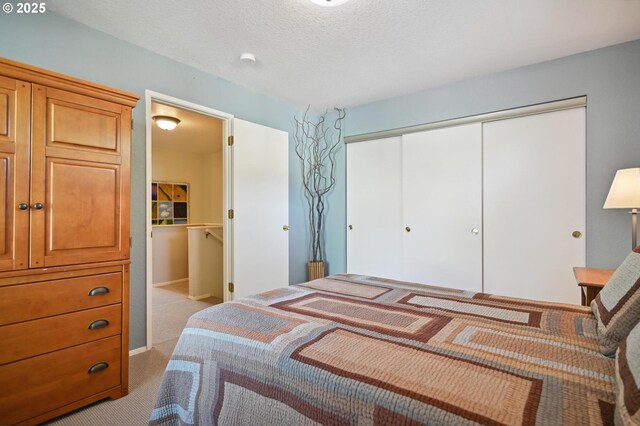 4701 NE 77th Ave, Vancouver, WA 98662 - bedroom featuring a closet, carpet flooring, and a textured ceiling