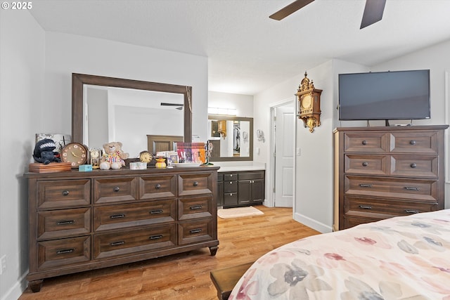 14644 SE Sterling Ct, Clackamas, OR 97015 - bedroom with light wood-type flooring, ensuite bathroom, and baseboards