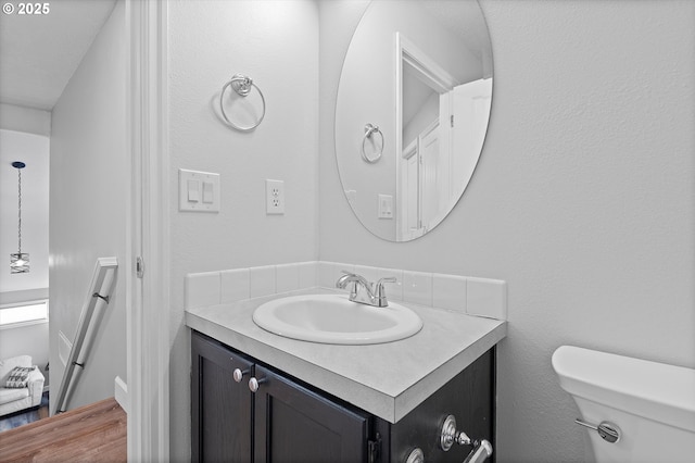 14644 SE Sterling Ct, Clackamas, OR 97015 - bathroom with vanity, toilet, and wood finished floors