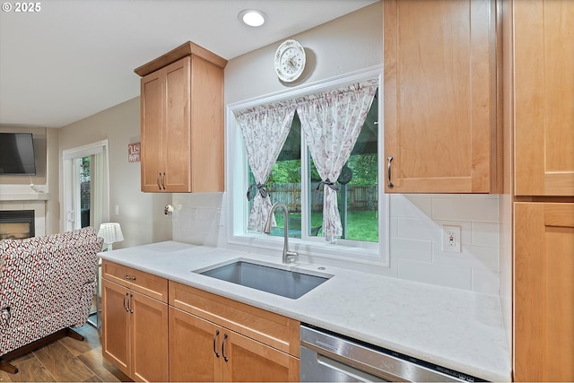 14644 SE Sterling Ct, Clackamas, OR 97015 - kitchen with a sink, stainless steel dishwasher, light countertops, and decorative backsplash
