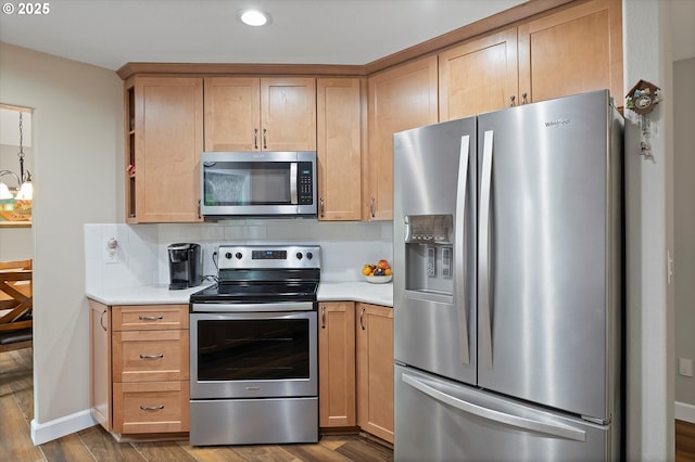 14644 SE Sterling Ct, Clackamas, OR 97015 - kitchen featuring stainless steel appliances, wood finished floors, light countertops, backsplash, and recessed lighting